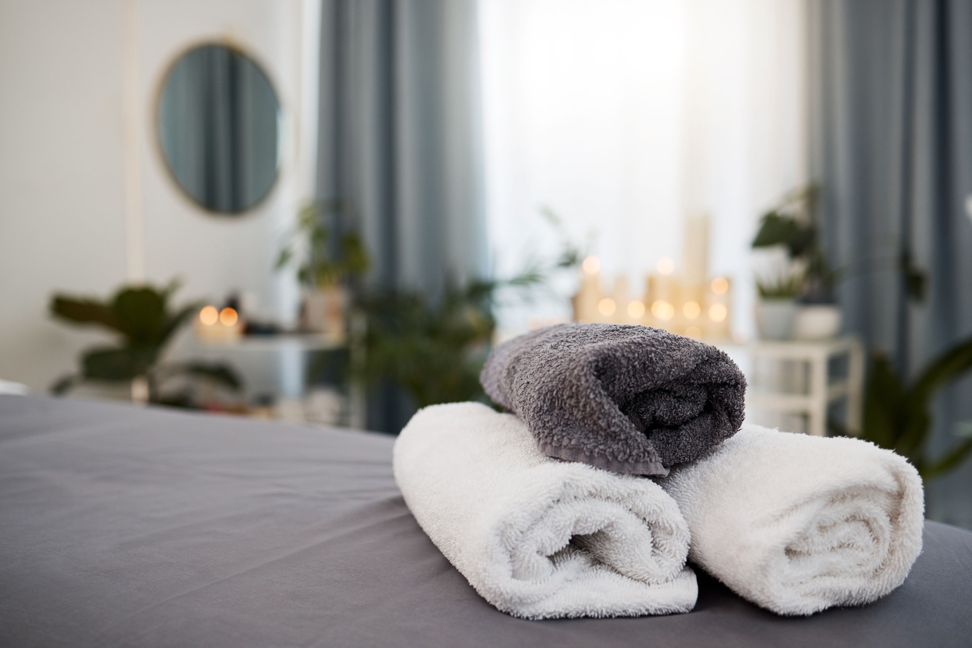 Shot of some towels on a bed in a spa